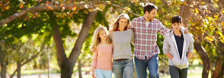 Chiropractic Cockeysville MD Active Family Wellness Walking In Fall Family of four taking a walking.