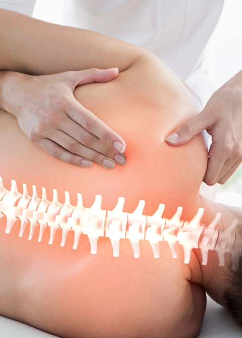 Patient receiving a back exam.