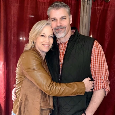 Courtney Miller smiling with her husband.