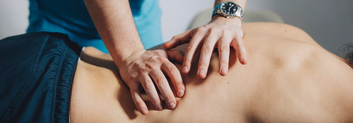 A person receiving a back massage.